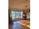 Living room with hardwood floors and a view of the backyard at 507 Dade Ct, Deltona, FL 32725
