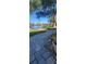 Brick pathway leads to lakefront view at 507 Dade Ct, Deltona, FL 32725