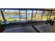 Enjoy lake views from this screened porch at 507 Dade Ct, Deltona, FL 32725