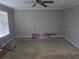 Spacious living room with large window and ceiling fan at 701 Priscilla Ct, Port Orange, FL 32127