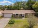 Charming single-story brick home with a well-manicured front yard and an attached garage at 1639 Templewood Ave, Deltona, FL 32725