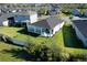 Aerial view of house and backyard, showcasing a spacious lawn and fenced-in area at 168 Azure Ct, Daytona Beach, FL 32124