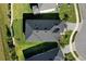 An aerial view showcasing a home's dark gray roof and surrounding landscape at 168 Azure Ct, Daytona Beach, FL 32124