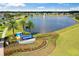 Community entrance sign with lake view and fountain at 168 Azure Ct, Daytona Beach, FL 32124
