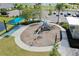 Community playground with swings and slides at 168 Azure Ct, Daytona Beach, FL 32124