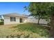 Spacious backyard with a white fence, providing privacy and ample space for outdoor activities at 2924 Taton Trce, New Smyrna Beach, FL 32168