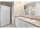 Clean bathroom with double sinks and a large mirror at 2924 Taton Trce, New Smyrna Beach, FL 32168