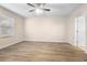 Bright bedroom featuring wood-look floors and a large window at 2924 Taton Trce, New Smyrna Beach, FL 32168