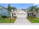 Charming one-story house with a two-car garage and well-maintained lawn at 2924 Taton Trce, New Smyrna Beach, FL 32168