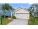 Charming single-story home with a well-manicured lawn and an attached two-car garage at 2924 Taton Trce, New Smyrna Beach, FL 32168