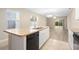 Kitchen island with double sink, dishwasher, and granite countertop at 2924 Taton Trce, New Smyrna Beach, FL 32168