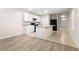 Modern kitchen with white cabinets, island, and black appliances at 2924 Taton Trce, New Smyrna Beach, FL 32168
