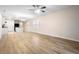 Open living room and kitchen area with vinyl flooring throughout at 2924 Taton Trce, New Smyrna Beach, FL 32168