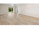 Spacious living area with vinyl flooring and access to backyard at 2924 Taton Trce, New Smyrna Beach, FL 32168