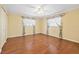 Inviting bedroom with hardwood floors and floral curtains creating a cozy atmosphere at 3019 John Anderson Dr, Ormond Beach, FL 32176