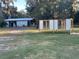 Outbuildings and a chicken coop are on this large property with ample room for other hobbies at 353 Vannote Rd, Pierson, FL 32180