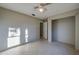 Simple bedroom with tiled floors and a closet at 4851 Orange Ave, Port Orange, FL 32127