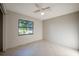 Empty bedroom with a window and tiled floors at 4851 Orange Ave, Port Orange, FL 32127