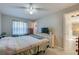 Bedroom with a double bed, dresser, and access to the hallway at 4851 Orange Ave, Port Orange, FL 32127