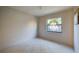 Small bedroom with a window featuring a decorative film at 4851 Orange Ave, Port Orange, FL 32127