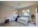 Cozy bedroom featuring a full bed, workspace, and natural light at 4851 Orange Ave, Port Orange, FL 32127