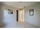Bedroom with tiled floors and access to a bathroom at 4851 Orange Ave, Port Orange, FL 32127