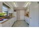 Efficient kitchen with white cabinets and wood countertops at 4851 Orange Ave, Port Orange, FL 32127