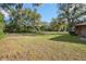 Spacious backyard with mature trees and a large grassy area, offering ample space at 1195 Glen Royal Ter, Deland, FL 32720