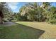 Expansive backyard with mature trees, offering privacy and space for outdoor activities at 1195 Glen Royal Ter, Deland, FL 32720