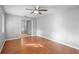 Bright bedroom with laminate wood flooring, neutral wall color, and a ceiling fan for comfort at 1195 Glen Royal Ter, Deland, FL 32720