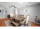 Cozy dining area with wood flooring, ceiling fan, and charming decor at 1195 Glen Royal Ter, Deland, FL 32720