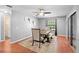 Elegant dining room with wood floors, modern lighting, and access to the patio at 1195 Glen Royal Ter, Deland, FL 32720