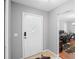 Welcoming entryway featuring a bright white door and view to home office, complemented by tiled flooring at 1195 Glen Royal Ter, Deland, FL 32720