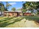Charming brick home featuring a lush front lawn and well-maintained landscaping at 1195 Glen Royal Ter, Deland, FL 32720