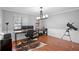 Comfortable home office with wood floors, featuring natural light and a modern work space at 1195 Glen Royal Ter, Deland, FL 32720