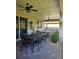 Relaxing covered patio featuring a dining table, ceiling fans, and hanging plants at 1227 Victoria Hills, Deland, FL 32724