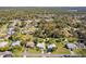 Aerial view of the neighborhood and surrounding wooded areas at 1437 Colin Kelly Ave, Daytona Beach, FL 32124
