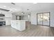 Modern kitchen with an island, and open to the living space with sliding doors at 1437 Colin Kelly Ave, Daytona Beach, FL 32124