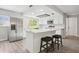 Contemporary kitchen features stainless steel appliances, a kitchen island, and white cabinetry at 1437 Colin Kelly Ave, Daytona Beach, FL 32124