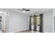Bright living room featuring a ceiling fan and sliding glass doors to the outdoors at 1437 Colin Kelly Ave, Daytona Beach, FL 32124