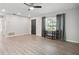 Living room boasts an open entry, lots of natural light, and stylish, neutral-toned flooring at 1437 Colin Kelly Ave, Daytona Beach, FL 32124