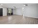 Expansive living room boasting continuous flooring, multiple ceiling fans and ample light at 1437 Colin Kelly Ave, Daytona Beach, FL 32124
