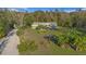 Charming single-story home with a spacious yard and verdant trees, perfect for Gathering living and country charm at 227 N Putnam Grove Rd, Oak Hill, FL 32759