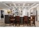 Open kitchen with a large island, barstool seating, and stainless steel appliances at 227 N Putnam Grove Rd, Oak Hill, FL 32759