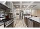 Beautiful kitchen with stainless steel appliances, a center island, and modern cabinetry at 227 N Putnam Grove Rd, Oak Hill, FL 32759