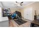 Spacious storage room with shelves, a deep freezer, safe, organized bins and laminate wood flooring at 227 N Putnam Grove Rd, Oak Hill, FL 32759