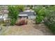 Aerial view of the home highlighting the backyard, patio, and lush greenery at 1083 E Normandy Blvd, Deltona, FL 32725