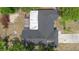 Aerial view of the property showcasing the roof, backyard, and surrounding landscape at 1083 E Normandy Blvd, Deltona, FL 32725