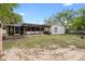 Spacious backyard features a pergola-covered patio and well-maintained lawn at 1083 E Normandy Blvd, Deltona, FL 32725