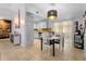 Dining area with tile flooring, slider to patio, and open access to the kitchen at 1083 E Normandy Blvd, Deltona, FL 32725